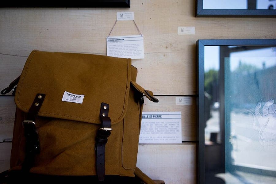 A modern travel backpack standing upright
